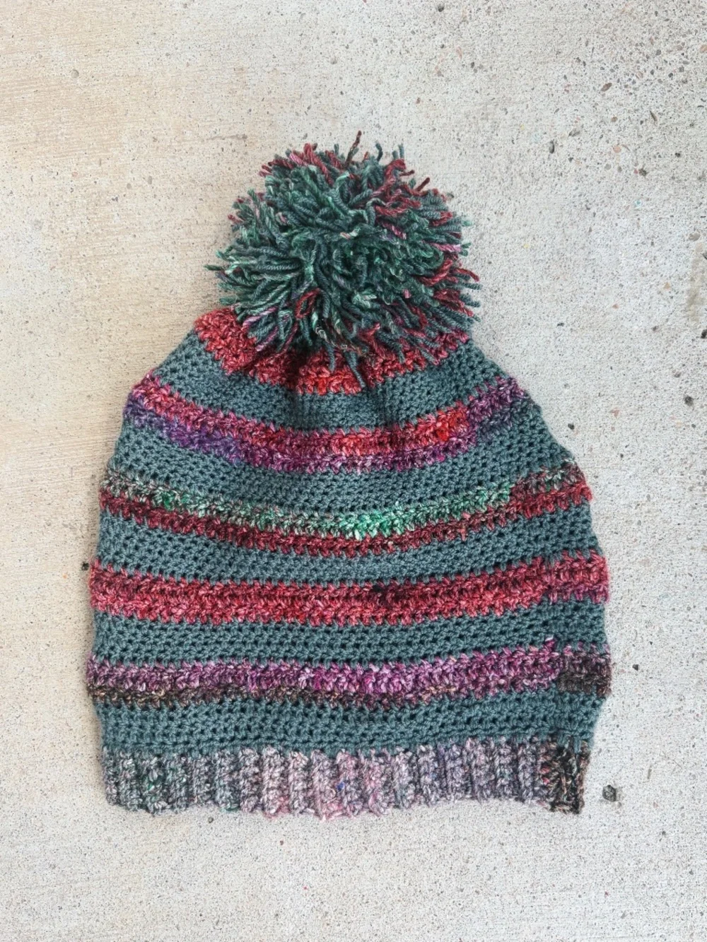 Handmade Crocheted Pom Pom Hat in Green with Colorful Stripes